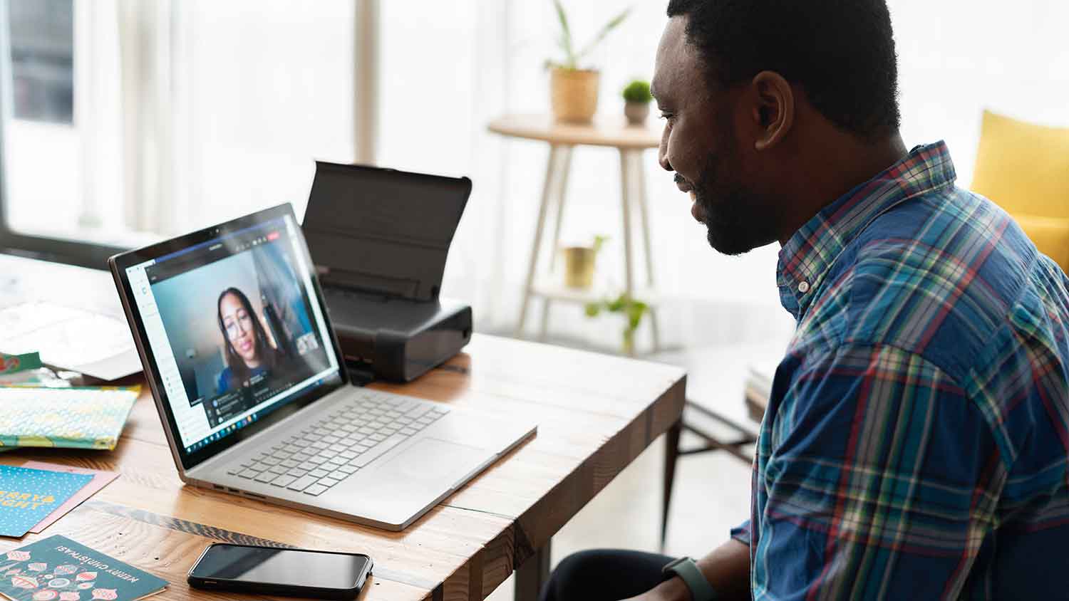 man and woman on a virtual meeting