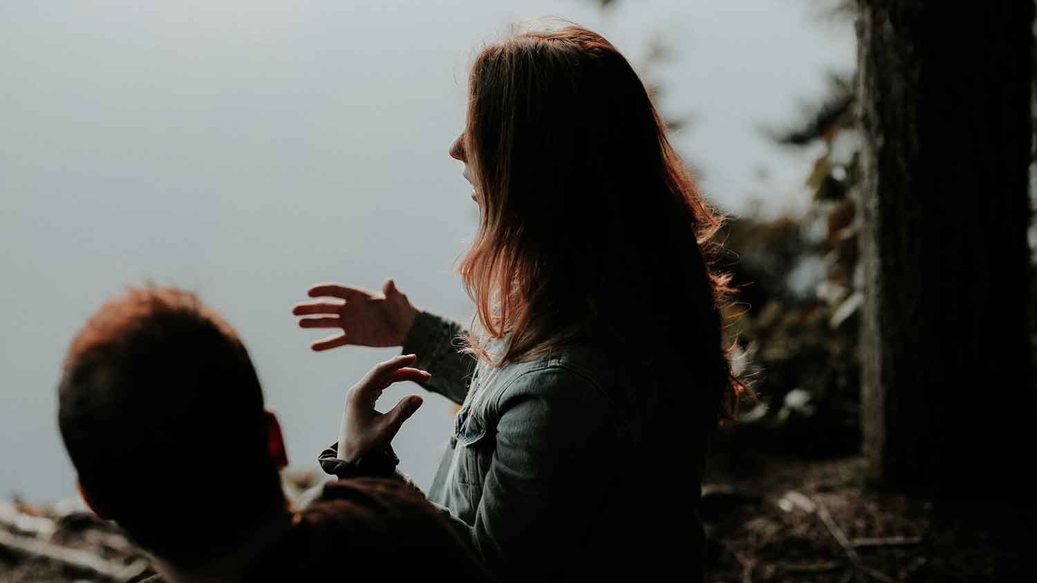 man and woman talking