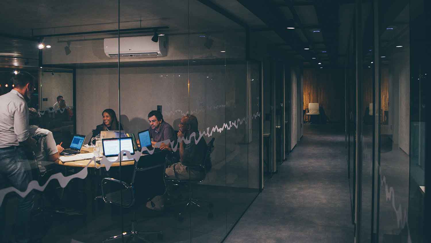 a geoup of people in an office boardroom